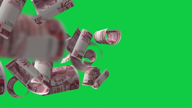 One Gibraltar pound flying slowly against a green background