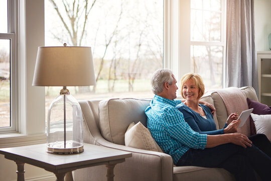 Credit card, tablet and relax with old couple on sofa for online shopping, digital payment or retirement. Internet banking, account password and customer purchase with senior man and woman in home