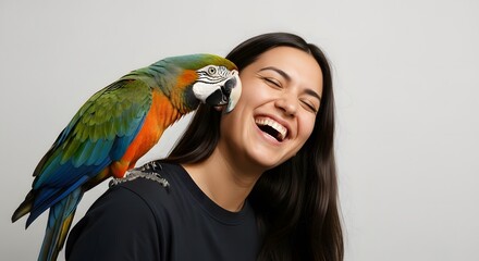 Person Laughing with Parrot on Shoulder, Joyful Interaction with Pet Bird, Exotic Animal Bond