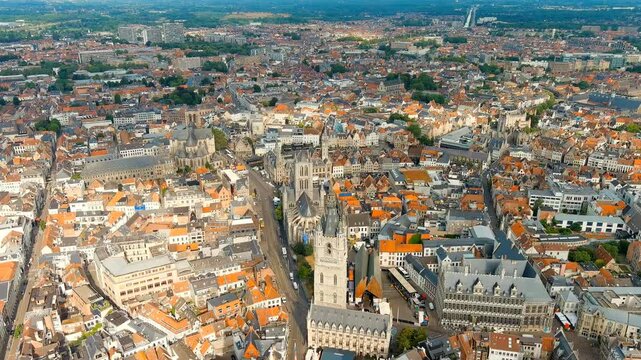 Ghent, Belgium. Cathedral of Saint Bavo. Panorama of the central city from the air. Cloudy weather, summer day. Drone footage, Departure of the camera, Departure of the camera
