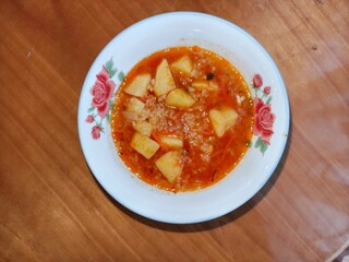 Hot potato a soup. Homemade comfort food. Delicious rustic dish. Ukrainian or Russian cuisine for lunch.