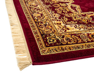 Close-up of ornate red and gold carpet with fringed edge