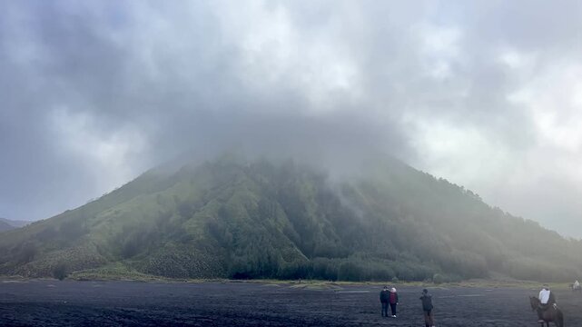 The beautiful scenery of Mount Batok and Teletubbies Hill in the Bromo Savanna area, Bromo Tengger Semeru National Park (TNBTS), Wonokitri Village, Tosari District, Pasuruan Regency, East Java