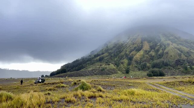 The beautiful scenery of Mount Batok and Teletubbies Hill in the Bromo Savanna area, Bromo Tengger Semeru National Park (TNBTS), Wonokitri Village, Tosari District, Pasuruan Regency, East Java