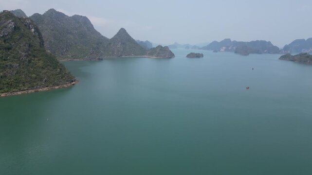 Drone view to karst mountains with the waters of Ha Long Bay near Cat Ba Island, Vietnam. 