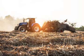 Sugarcane leaves compressed into bales by a baler machine after harvest. Post-harvest biomass management concept highlighting mechanized farming, renewable resources, and sustainable agriculture.