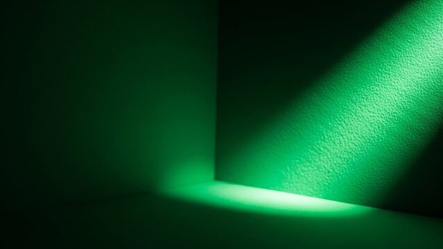 Green spotlight shining on dark corner of room