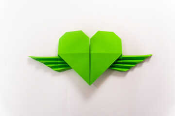 origami heart with wings on white background.