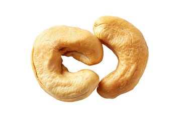 Two raw cashews, facing each other, a  top-down close-up view