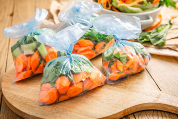 Assortment of fresh vegetables prepared and packaged for freezing