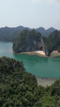 Drone view to karst mountains with the waters of Ha Long Bay near Cat Ba Island, Vietnam. 