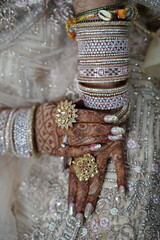 Indian bride's hands adorned with henna.