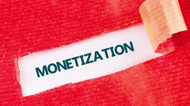 Red textured material slowly peels back revealing the word monetization written in capital letters. The text transitions from faint outline to solid blue lettering on a white surface