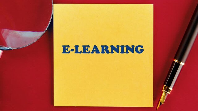 E-LEARNING text emerges on a yellow sticky note. A fountain pen lies nearby on a bright red surface. This visual shows the development of digital learning ideas
