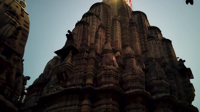 Hatkeshwar Mahadev Mandir Temple Vadnagar Gujarat India glowing at dusk showing Hindu temple architecture spiritual heritage landmark at evening.