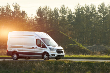 Delivery van moving on countryside highway