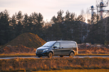 Fototapeta premium Delivery vehicle passing countryside area