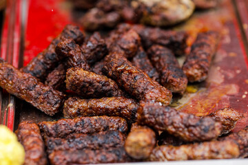Details with mititei (mici), grilled minced meat in a farmers market