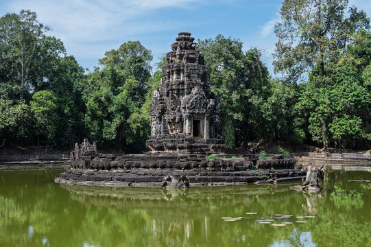 Historic stone sanctuary of neak pean temple located on artificial island in middle of jayatatake baray in angkor cambodia