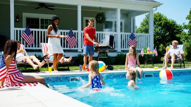 Lively backyard pool party for Fourth of July with families, barbecue, and kids splashing in the water.
