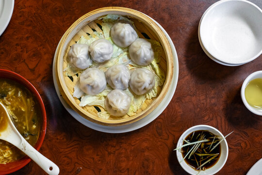 Chinese soup dumplings in bamboo steamer view from above