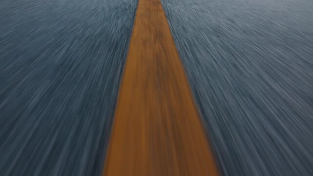 Camera moves fast forward over the asphalt road