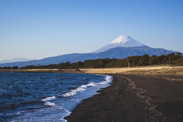 Majestic Mount Fuji with snow cap viewed from the coast in Numazu