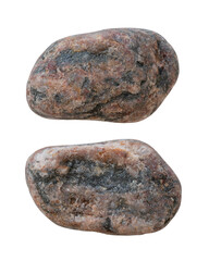 Two different sides of the same stone, isolated on a white background. Close-up of the pebble texture.