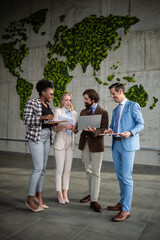 Diverse business team discussing global sustainability initiative © Zoran Jesic