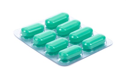 Green capsules in blister pack.