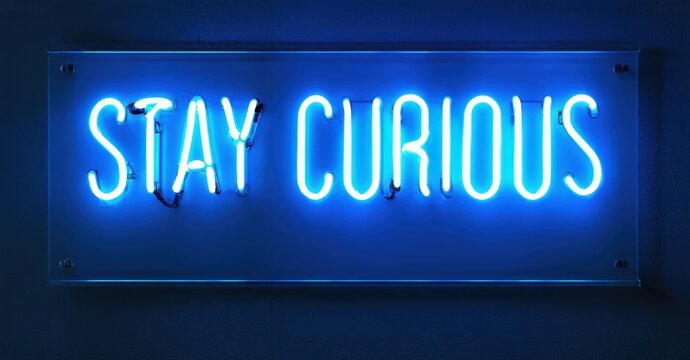 Bright neon sign displays positive message. Blue glow contrasts dark background. Simple typography, modern aesthetic. Inspiring words promote learning.