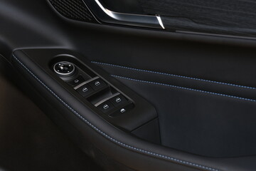 Obraz premium Premium electric car cabin detail with modern door panel design and advanced control interface. Suitable for commercial advertising and future transportation visual themes.