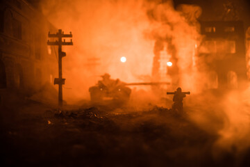 Fototapeta premium Military soldier silhouette with bazooka. War Concept. Military silhouettes fighting scene on war fog sky background, Soldier Silhouette aiming to the target at night.
