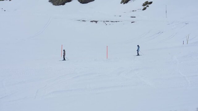 Skiers waiting at a slalom training course in davos klosters