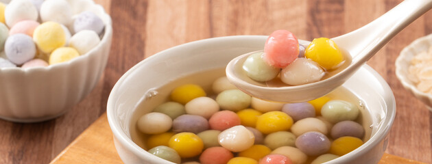 Colorful sweet glutinous rice balls tangyuan in sweet ginger syrup soup