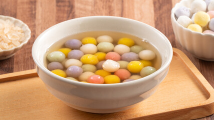 Colorful sweet glutinous rice balls tangyuan in sweet ginger syrup soup