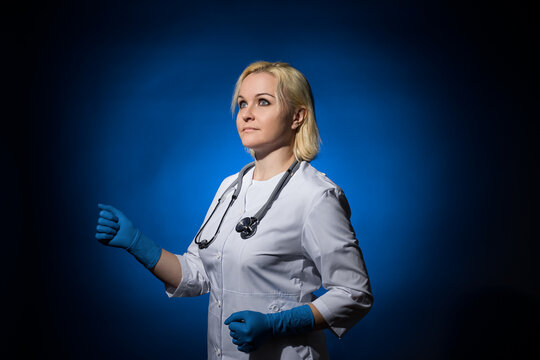 female doctor walking to the left in the dark