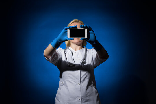 smartphone instead of eyes in a female doctor. blank for designers
