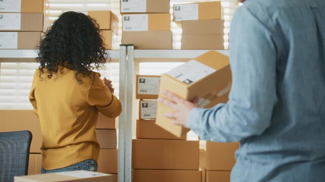 A small business team processes online orders by packing products, E-commerce fulfillment staff organizing inventory checking packing lists, packaging tasks, verify orders before shipment, dispatch.