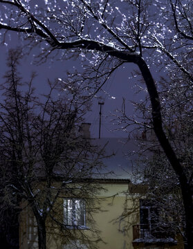 
A winter cityscape with old historic buildings covered in a glistening layer of ice after freezing rain