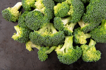 Fresh broccoli on a dark background. Top view.
