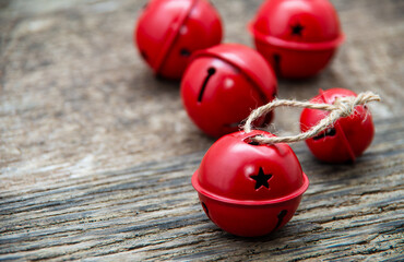 Christmas Jingle bells on a rustic wooden background