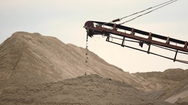 Industrial plant with belt conveyor in open pit mining Sand quarry. Construction site, Industry machine for stone crusher.
