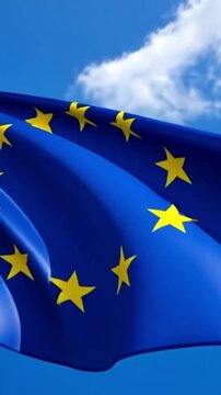 European Union flag waving under bright blue sky shows unity among member states