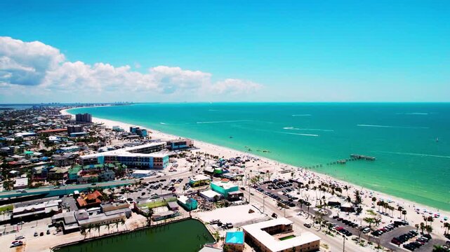 4K drone aerial view flying over the Gulf of Mexico off Fort Myers Beach, Florida on 22 March 2025, showing turquoise water, sandy shoreline and coastal landscape from bird&rsquo;s-eye perspective