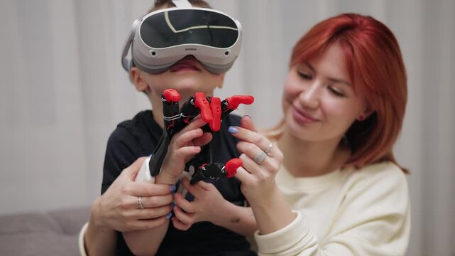 Young caucasian child experiencing virtual reality with adult female's guidance.