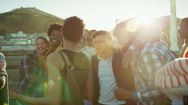 Happy friends laughing together outdoors