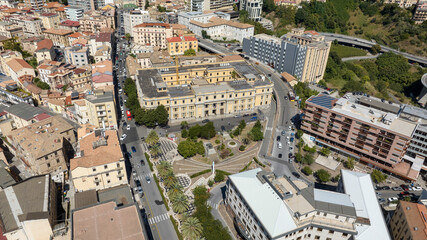 Obraz premium Aerial view of Piazza Matteotti, located in the historic center of Catanzaro, Calabria, Italy. The square is surrounded by the houses, buildings, and roofs of the city.