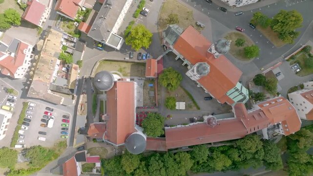 Abstract top-down aerial view of the historic ensemble in Borna, Saxony. The vertical perspective shows the geometric arrangement of St. Mary's City Church and the Borna City Museum (former castle).
