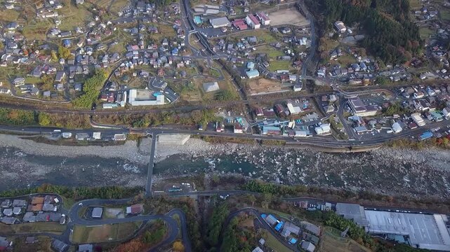 Flyover quaint Nagiso town on Kiso River in Central Alps of Japan